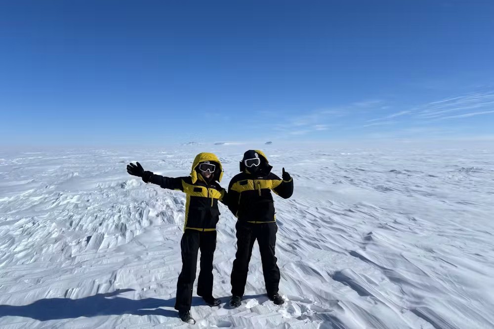 Geologists Jacqueline Halpin and Jack Mulder stand on the Denman Glacier during recent fieldwork. Image credit Jacqueline Halpin