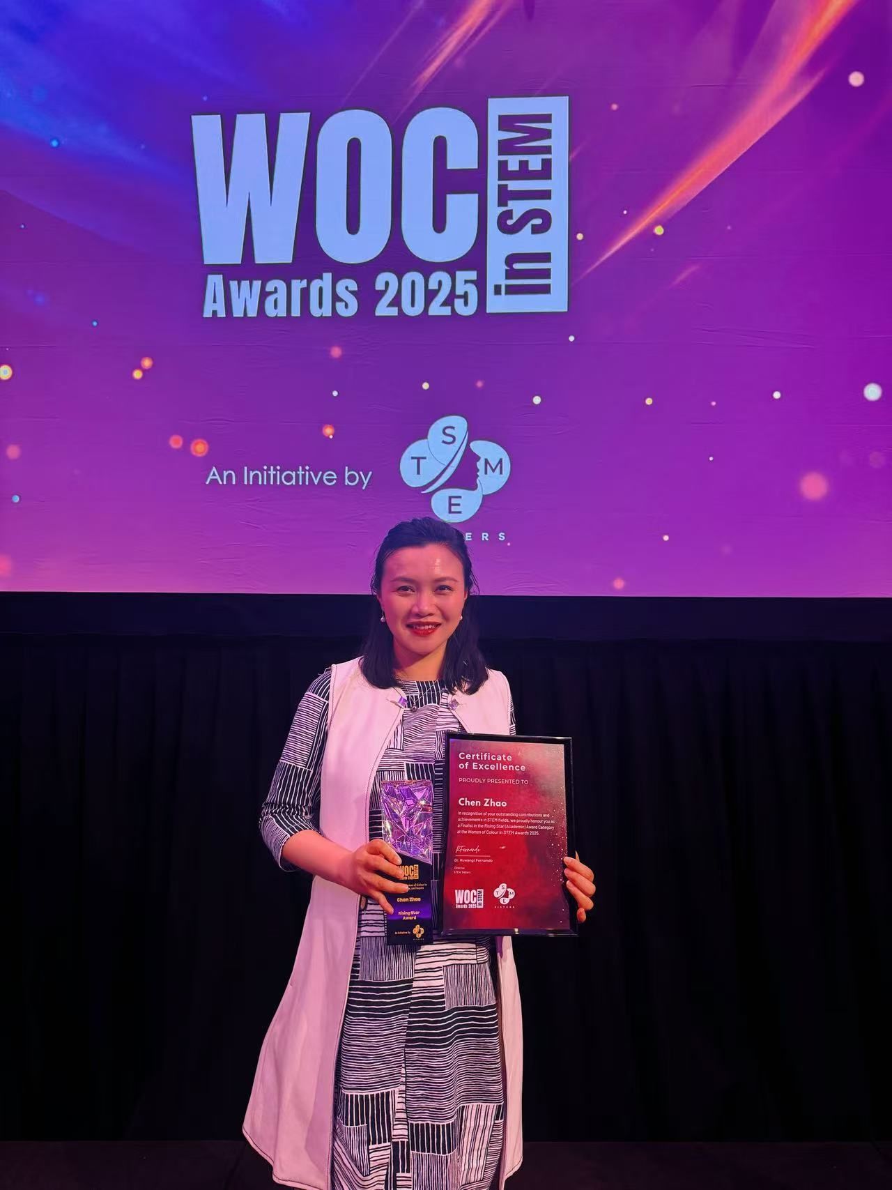 Dr Chen Zhao receiving the Rising Star award at the 2025 Women of Colour in STEM Awards.