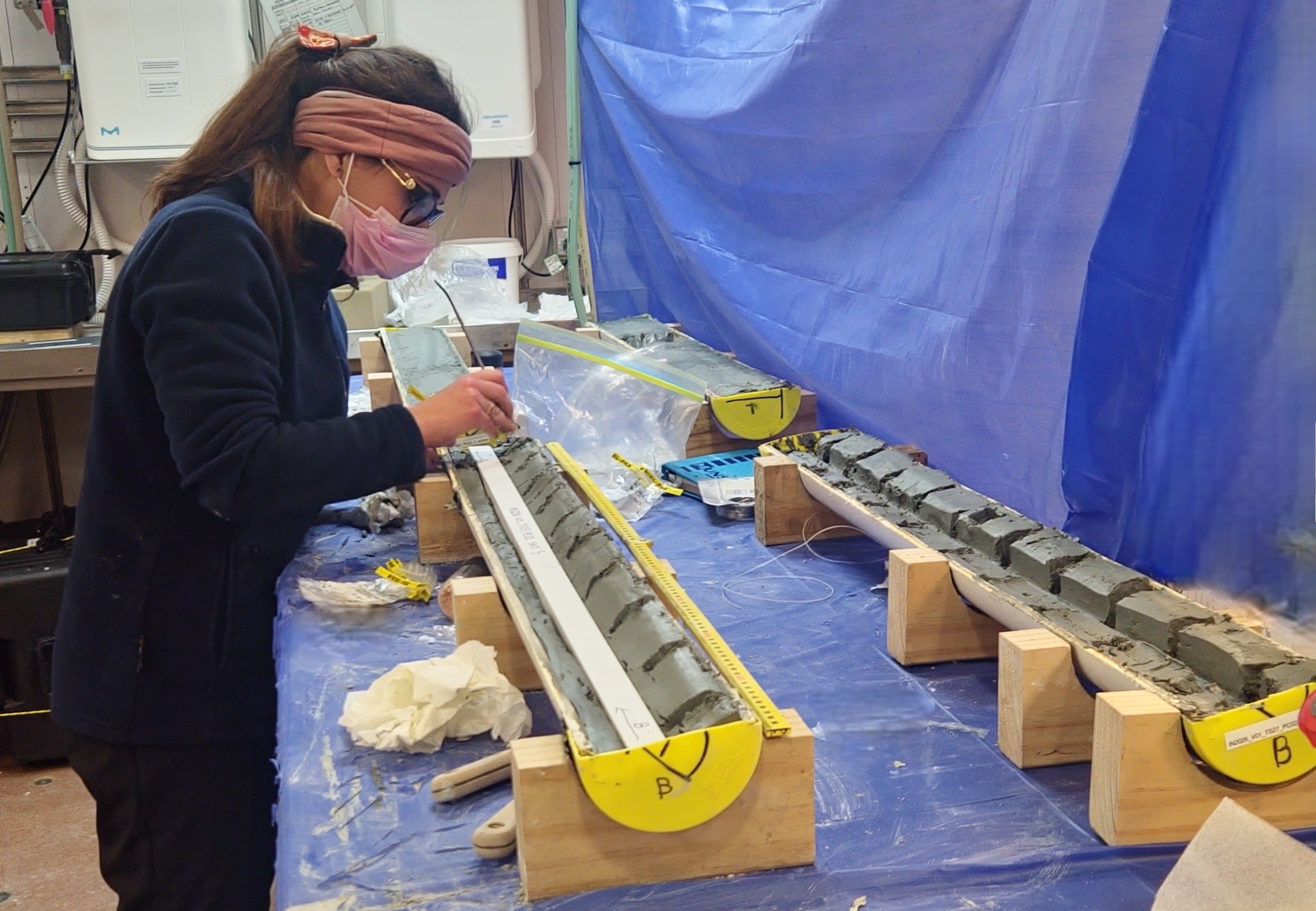 Dr Fiorenza Torricella (National Research Council-Institute of Polar Sciences, Italy) sampling segments of the core.