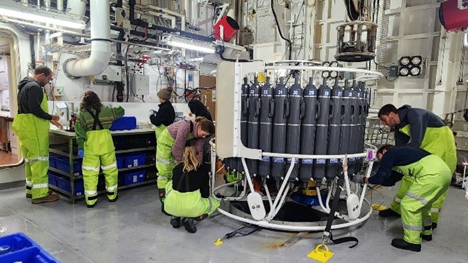 PM Science team taking CTD/Niskin water samples. Image credit: J. Lalime.