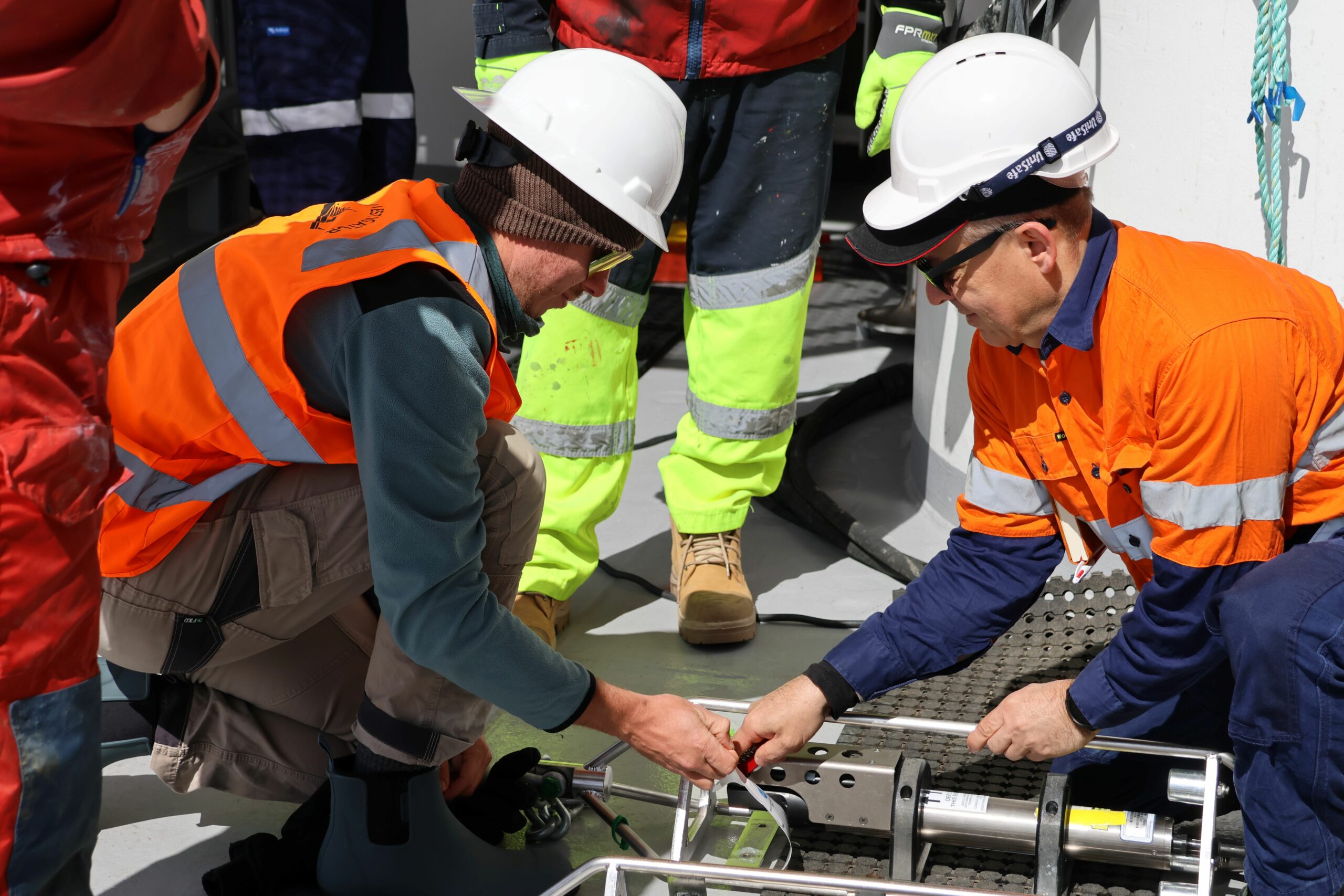 Oceanographers James Wyatt (lead author, left) and Benoit Logres prepare instruments to attach to a mooring in the Southern Ocean. Credit: Amelia Pearson.